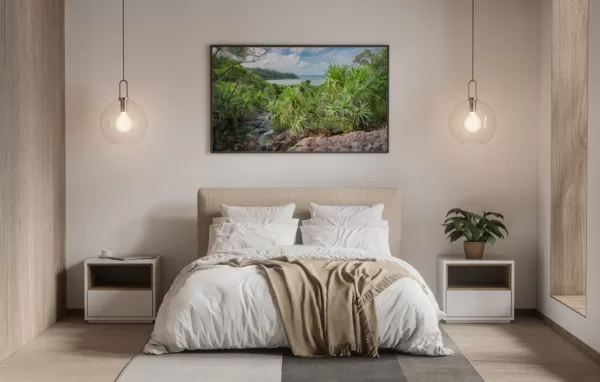 A stunning landscape photo print of the Pandanus Oasis, an Australian tropical coastal scene featuring lush palm trees and crystal clear water.